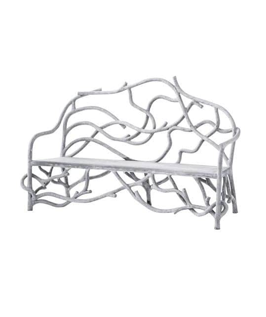 A metal bench with an intricate design, featuring a curved backrest and armrests, set against a white background.