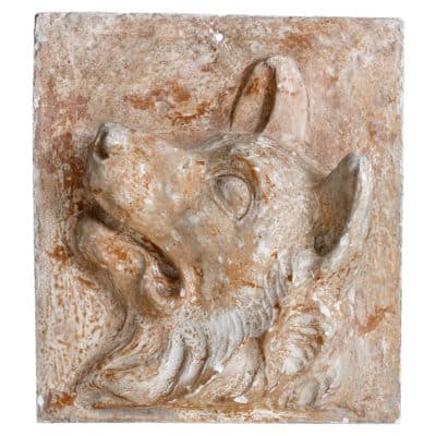 Vintage plaster dog head relief plaque with aged faded finish