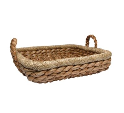 Handmade seagrass basket with handles, perfect for beach decor or everyday use.