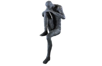 Bronzed iron shelf statues depicting a man in various poses including one with his elbow on his knee and another standing upright