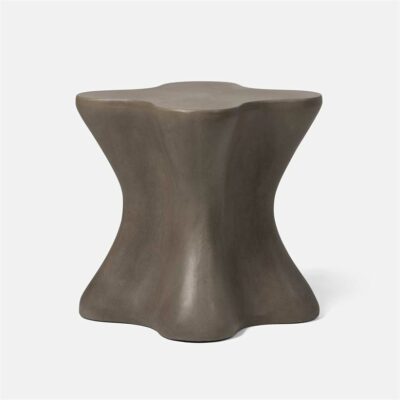 Outdoor concrete side table with raw finish and natural imperfections.