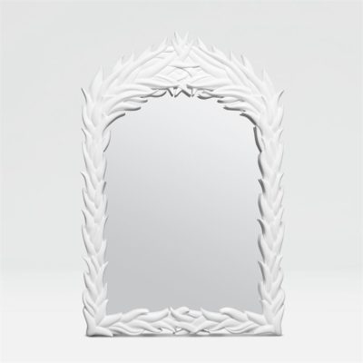 White wall mirror with leafy border.