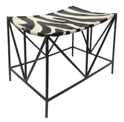 Darius iron framed stool with zebra print hide seat. Black frame, faux zebra pattern on seat. Two variations available in Houston.