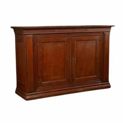 Close-up of dark brown wooden buffet with inlaid design, two interior shelves per door, and slim upper drawers with small ring pulls.