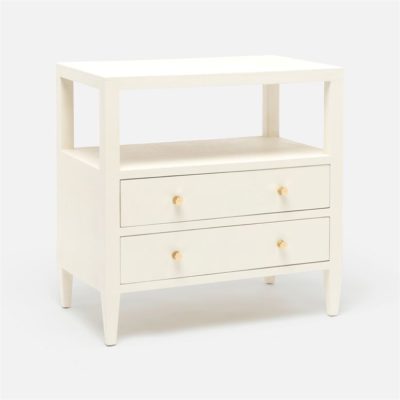 A large, light-colored side table with two drawers and a top shelf, featuring gold-finished pulls, against a white background.