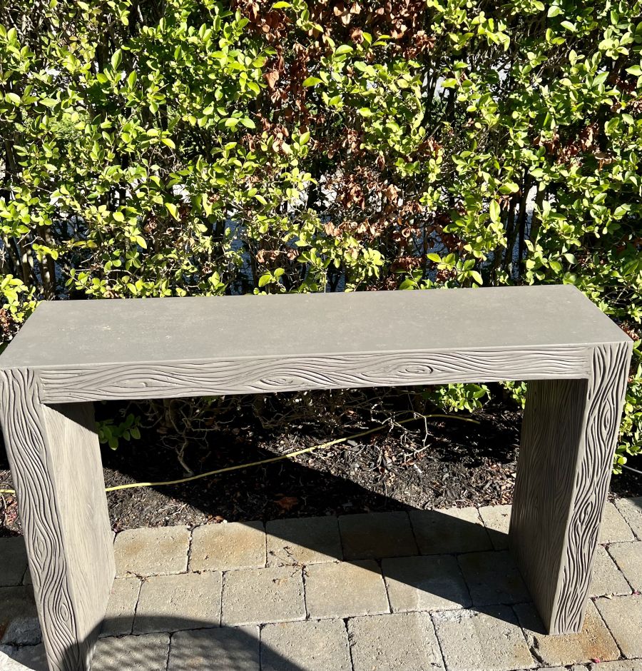 The Outdoor Etched Concrete Parsons Console in dark gray concrete, showcasing its sturdy construction and elegant design.