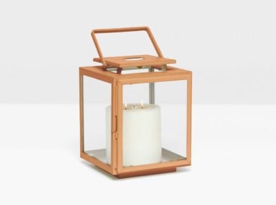 A wooden hurricane lantern with a glass jar and a candle, placed on a surface.