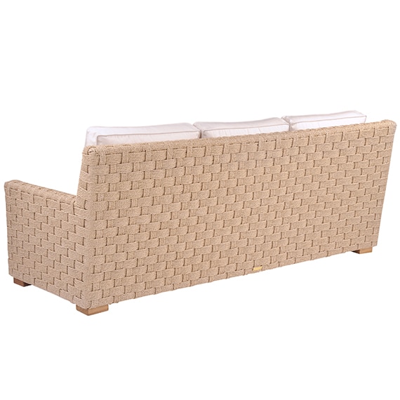 The image shows an outdoor sofa with a wicker seat and backrest featuring a rust-proof aluminum frame wrapped in all-weather rope It