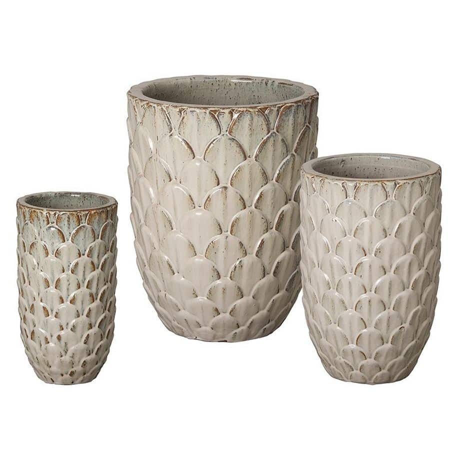 Three vases with a textured design, one larger and two smaller, in shades of gray and white against a white background.