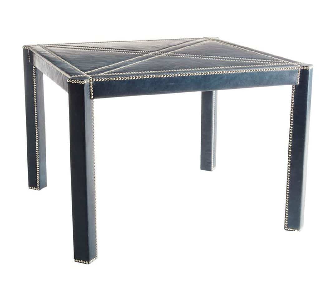 A dark blue, modern coffee table with a geometric pattern on its top and black legs.