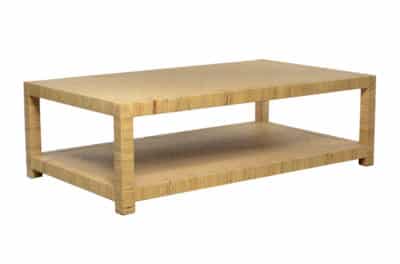 Rattan and raffia coffee table with a mahogany wood frame, displayed in an east warehouse setting.