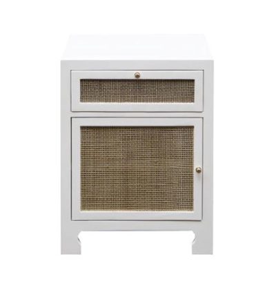 Small white lacquered front cabinet with a single door and top drawer, set against a neutral background.
