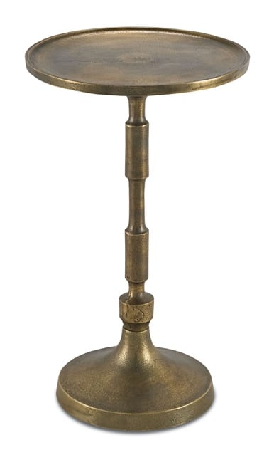 Antique brass side table with a round top and three legs, standing against a white background.