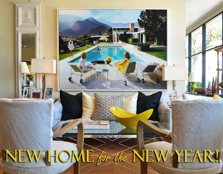 A cozy living room with a large colorful painting featuring a family lounging by a pool set against a wall with the