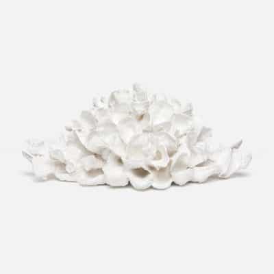 White resin oyster shell sculpture in a pile
