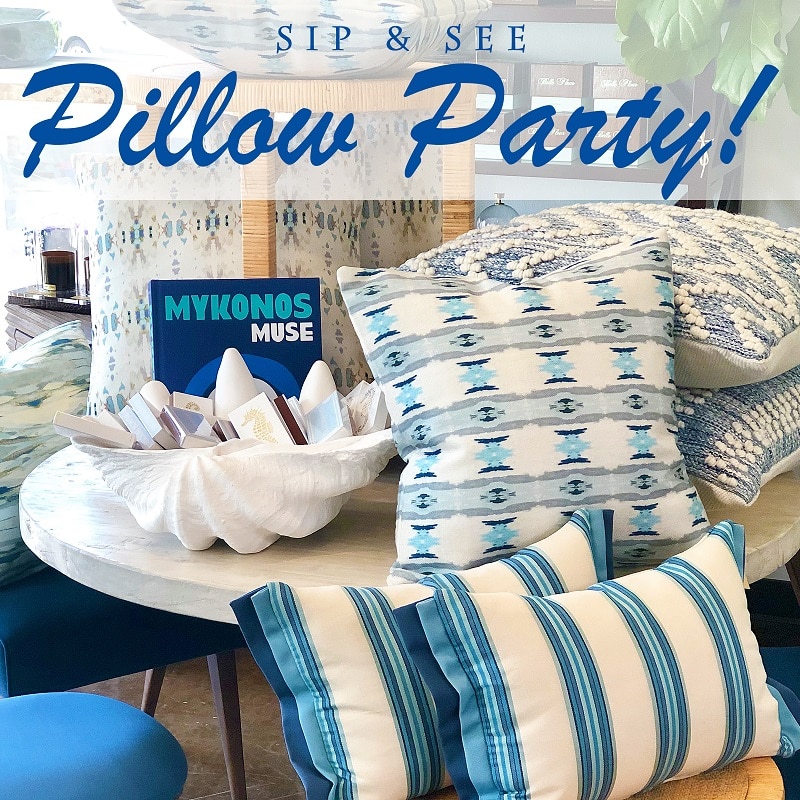 Pillows on a table with a sign that reads PILLOW PARTY and another that says MYKONOS MOSE The pillows are in shades