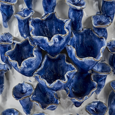 Blue and white ceramic vase with various shapes and sizes, forming a decorative pattern in the image.