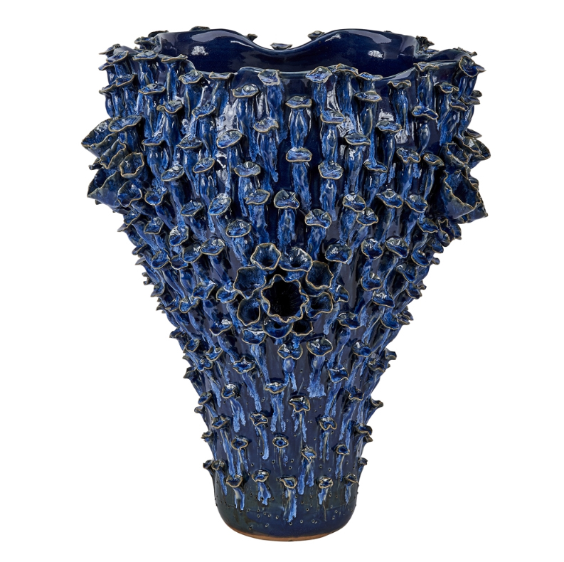 Large blue and white ceramic vase with intricate detailing and a unique irregular shape showcasing a combination of glazes and colors that