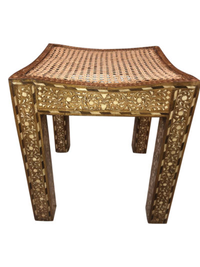 Mother of pearl inlaid stool with cane seat, showcasing intricate designs and unique variations in finish and color due to natural materials.