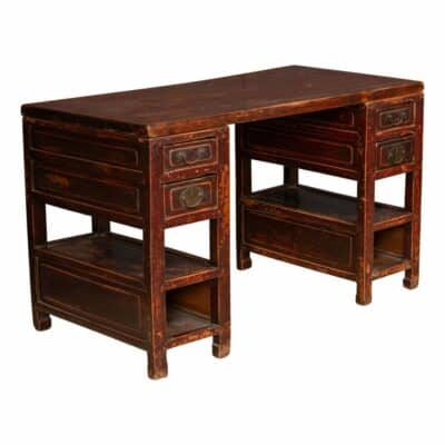 Antique Chinese desk with four drawers and two shelves, circa 1900.