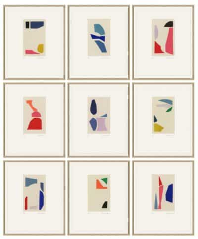 A collection of seven abstract art prints each featuring bold geometric shapes and vivid colors framed in oak with a white mat