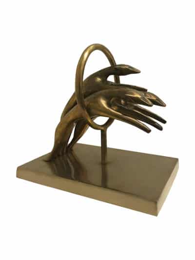 Bronze sculpture of three jaguars, capturing a dynamic moment in a display case on a white background.