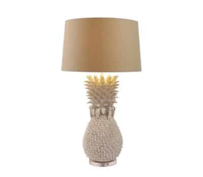 A large white pineapple lamp with a brown shade and a gold accent on the base, available in blue.