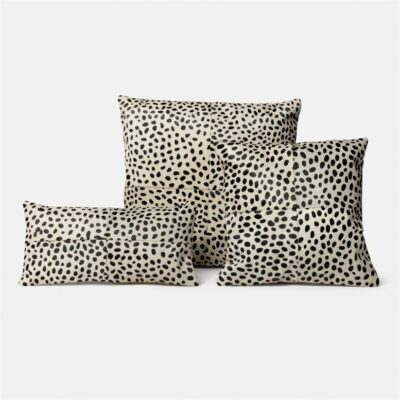 Three stylish Dalmatian print hair-on-hide pillows in a matching set, perfect for adding texture and visual interest to your home decor.