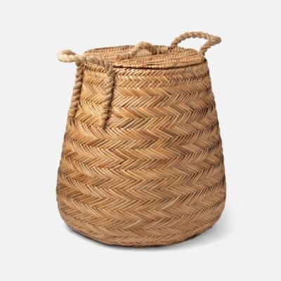 Woven chevron rattan hamper basket with side and top handles.