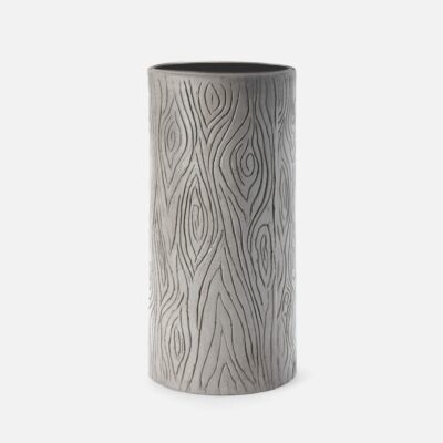 Close-up of a Faux Bois Umbrella Stand with pattern etched in dark gray concrete.