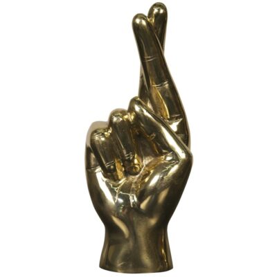 Brass sculpture depicting hand with fingers crossed in luck gesture.