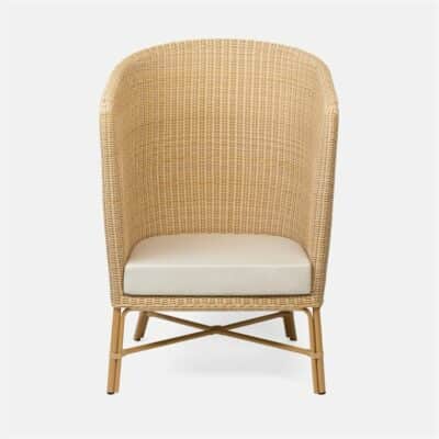 Striped wicker chair with white cushion and dark frame, side view.