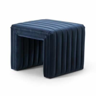 Stylish navy velvet ottoman on display.