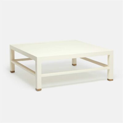 Square coffee table, light wood finish, white top surface