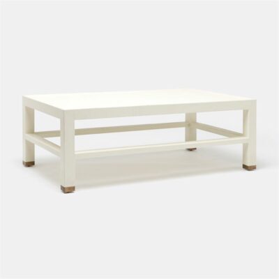 The product is a rectangular faux Belgian linen coffee table with a gold-finished cap on its edges It s presented in a