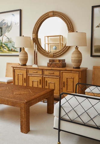 AOA-Mecox furniture set displayed in a modern living room featuring a large wooden dresser a beige sofa a round mirror two matching