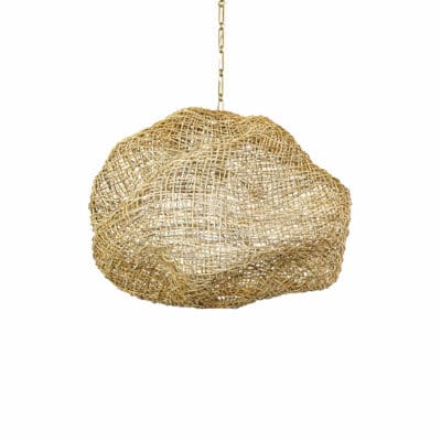 A golden pendant light featuring a medium-sized abstract wicker shade with open split rattan weave over a metal frame antiqued brass finish