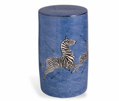 A blue stool with a zebra design, featuring two zebras in a running pose on its side.