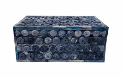 Blue rectangular coin box with hinged lid featuring a glossy blue surface adorned with small circular indentations and a row of metal