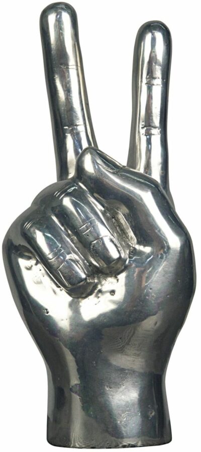 Silver peace sign hand sculpture on display.