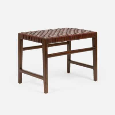 Dark brown wood and leather bench with a woven leather seat featuring a rectangular top and four legs presented in a clear