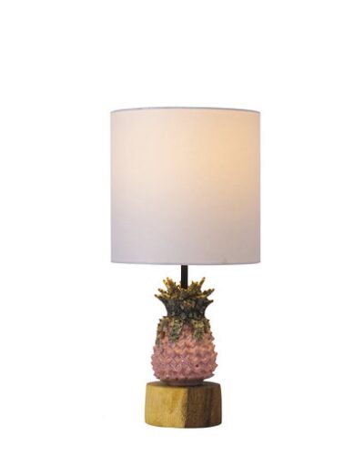 Petite ceramic pineapple lamp on wooden base, featuring a pink shade and set against a white background.