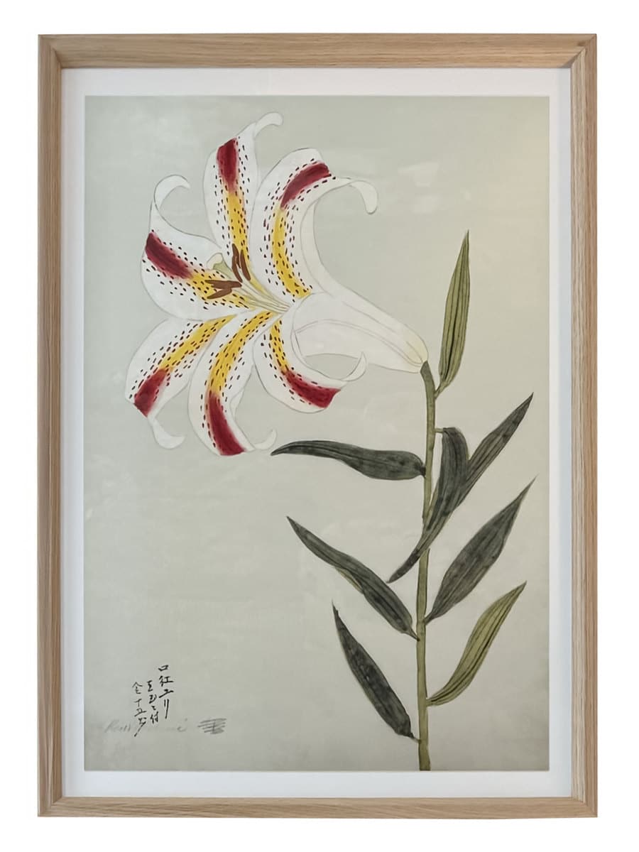 Close-up of framed reproduction print featuring vibrant red lilies with yellow accents in a classic floral arrangement.