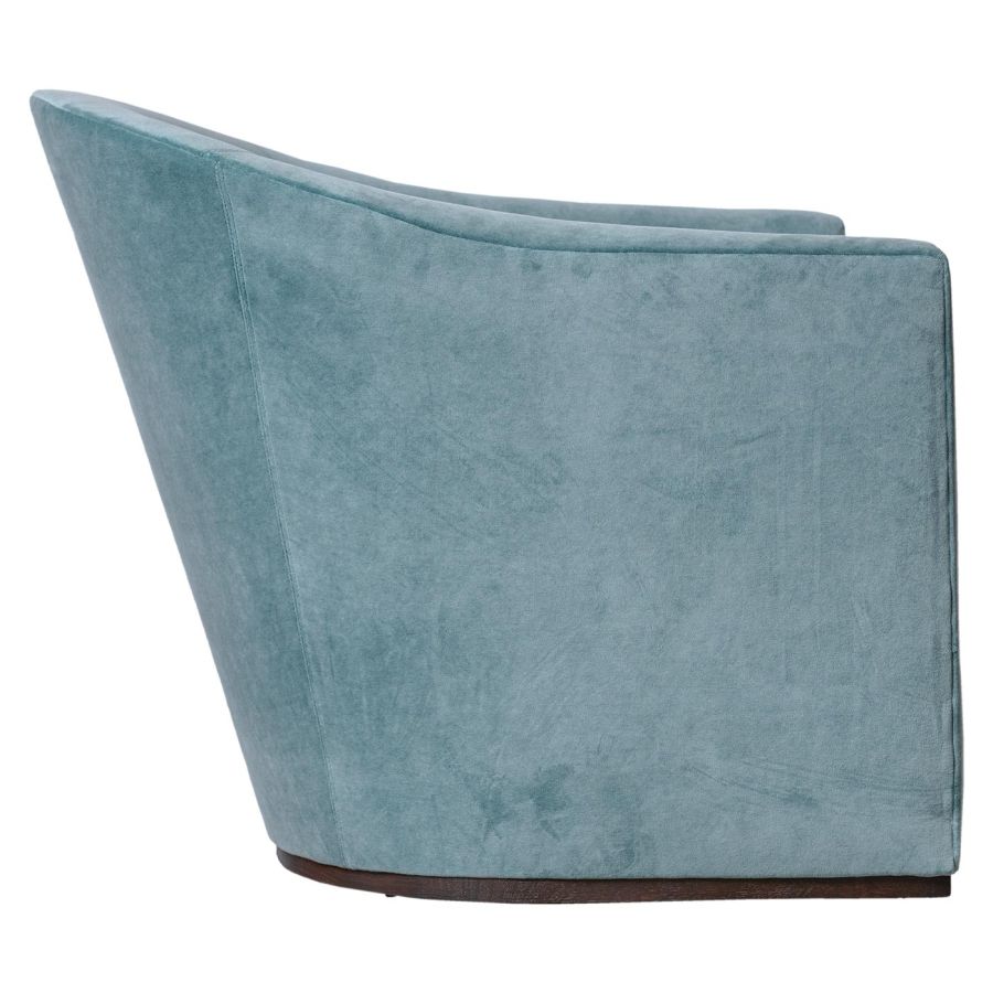 Luxurious velvet swivel chair with ocean blue fabric, featuring a tufted backrest and a spring-down seat cushion on a wooden base.