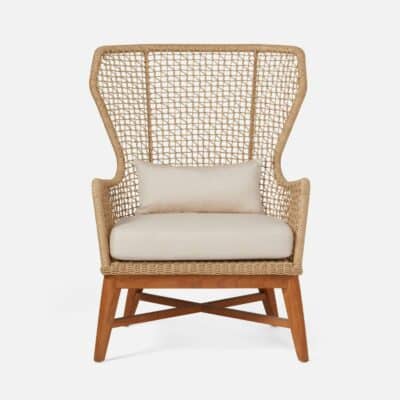 Elegant outdoor wicker chair with natural teak legs, featuring two plush white cushions for comfort.