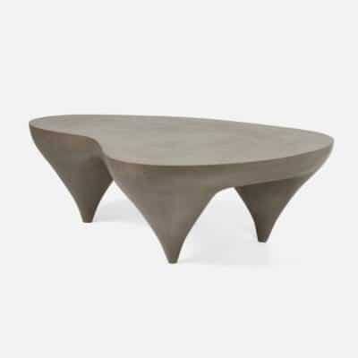 Contemporary outdoor curvy concrete coffee table, showcasing its smooth gray surface and unique sculptural design.