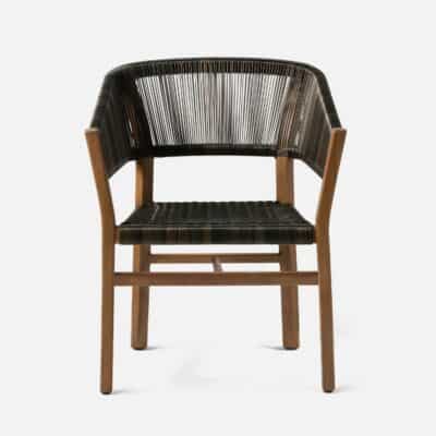 Modern outdoor dining chair in dark espresso faux wicker with aged natural teak details offering a stylish blend of comfort and sophistication