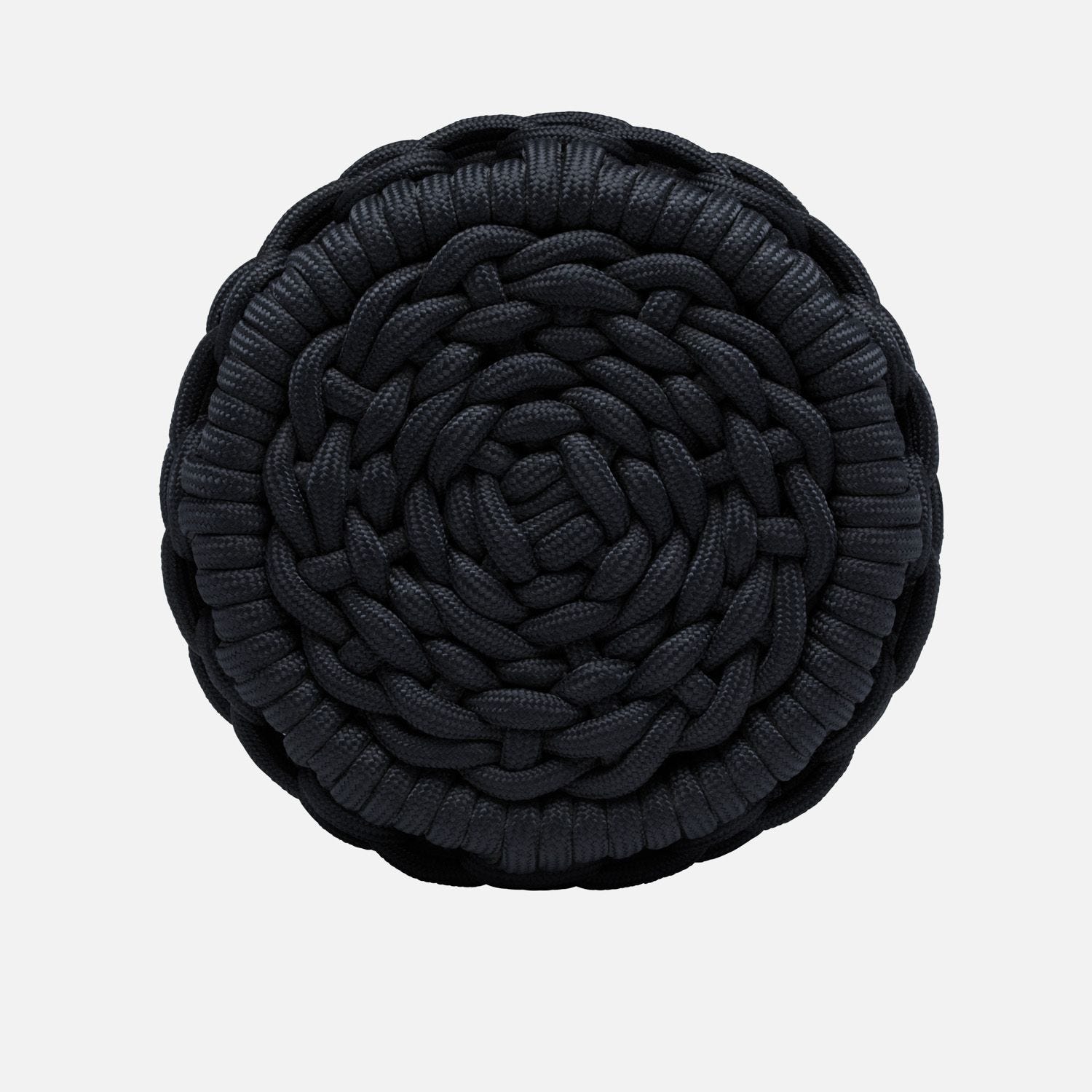 A round, dark blue stool with a braided rope pattern, presented in a close-up view against a white background.