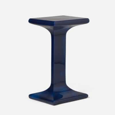 Glossy blue cast resin side table, modern design with a sleek rectangular top and a sturdy square base.