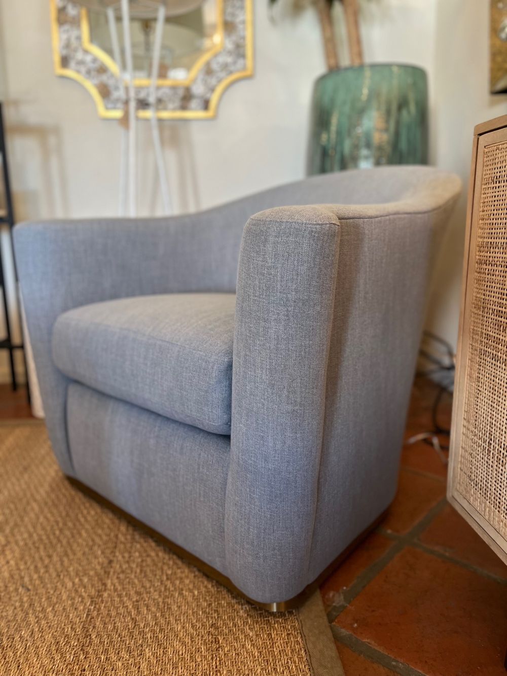 Mecox Exclusive Arlette French Moderne Swivel Chair in River Blue, upholstered in heavy duty woven polyester/cotton fabric with brass clad base.